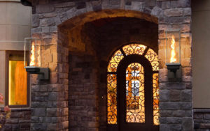 tempest torch wall sconces by travis industries at beautiful front entrance