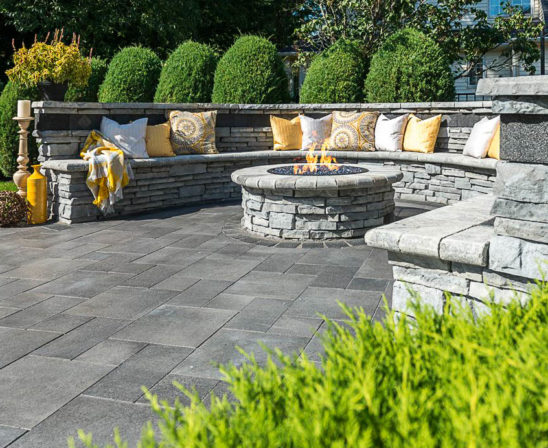 unilock umbriano pavers in midnight sky with rivercrest coastal slate stone for natural bench and wall