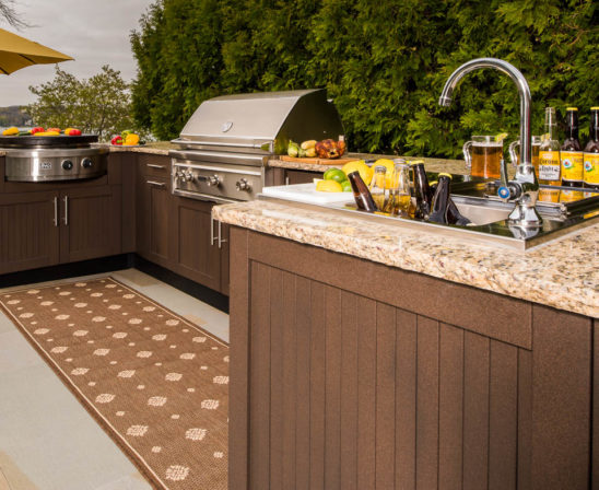 danver outdoor kitchen with sink, range, grill and granite counter tops