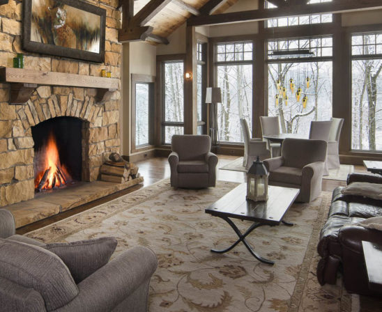 superior clay rumford fireplace in living room with natural stone feel