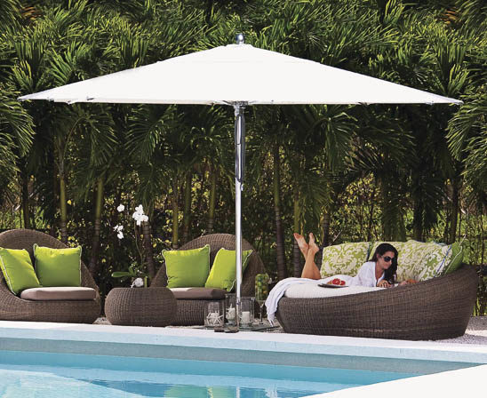 tuuci 10 foot hexagon umbrella in white by pool with wicker furniture