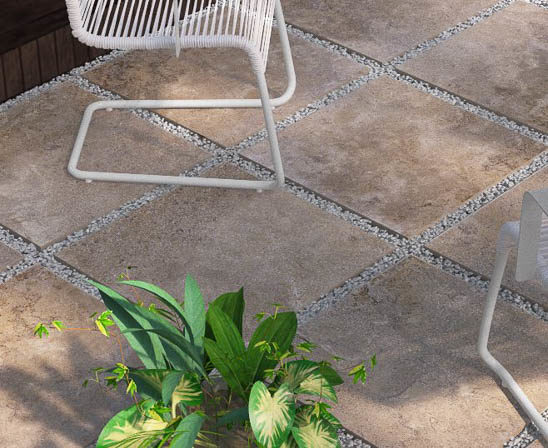 unilock's landscape porcelain tile in travstone noce