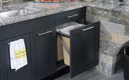 brown jordan outdoor kitchen storage doors and trash drawer with sparkly gray stone backsplash