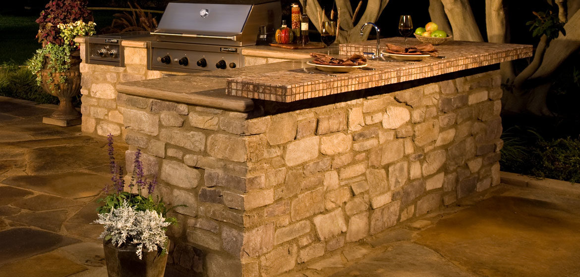 eldorado outdoor kitchen with built in grill and tile top cantilever bar