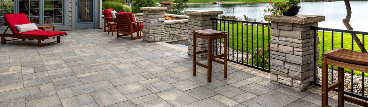 unilock bristol valley concrete paver patio with rivercrest wall columns and retaining wall