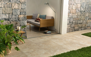 unilock caesar porcelain landscape tile on an outdoor patio adjacent to an interior space