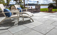 unilock natural stone flagstone winter mist with adirondack chairs