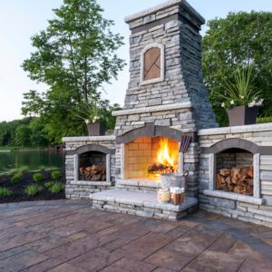 Stone chimenea with built in sheltered wood storage. 