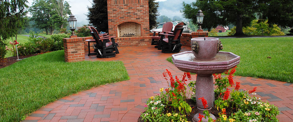 Brick patio with built in fire feature. 