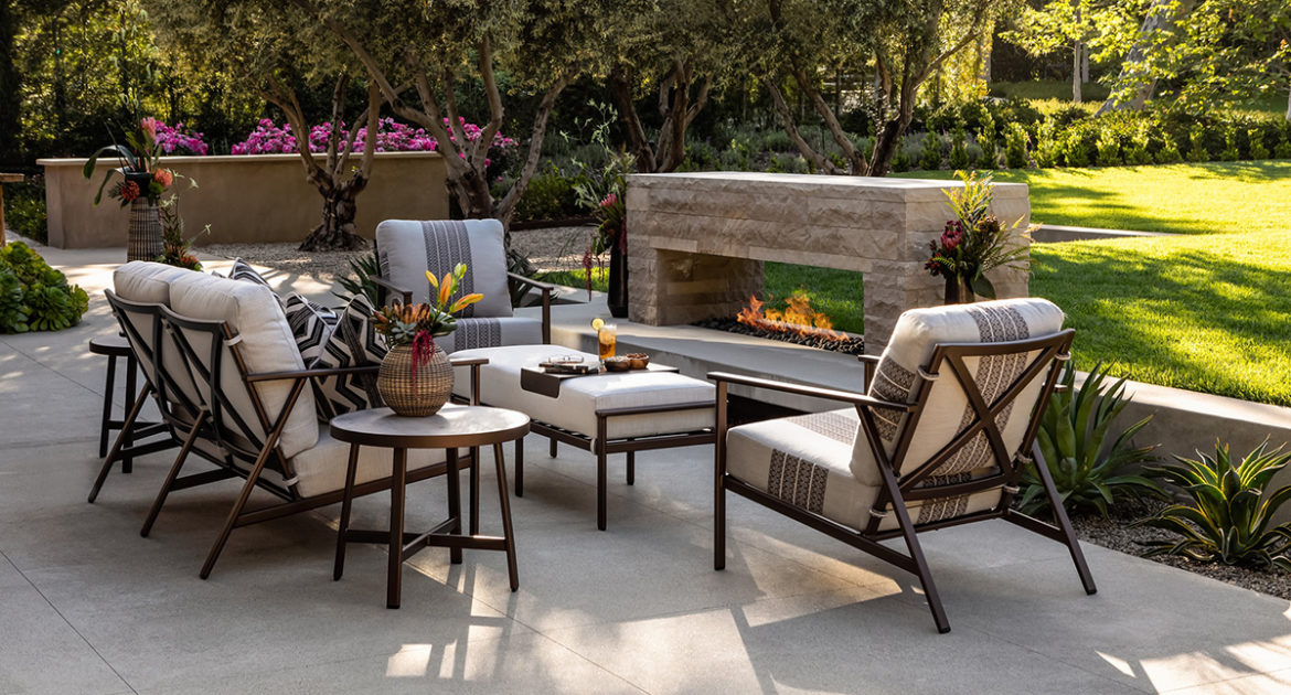 Outdoor sitting area with fireplace.