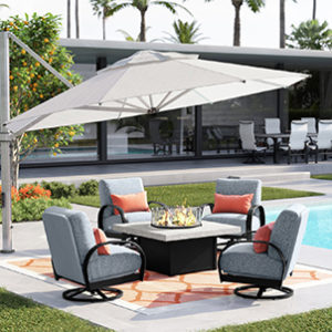 Poolside sitting area with a shade umbrella and fire feature. 