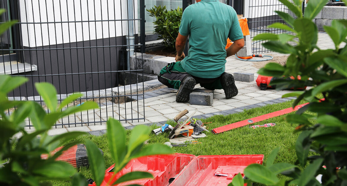 Installing stone paver patio.